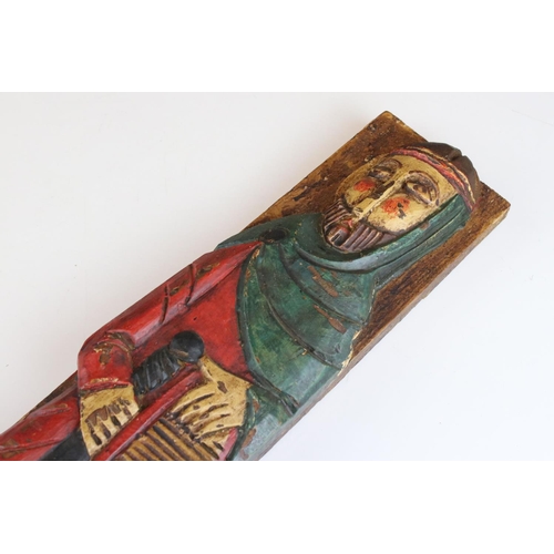 66 - Two decorative painted carved wooden figures.