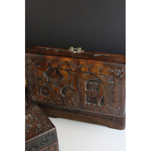 78 - A set of three oriental carved wooden graduated boxes.