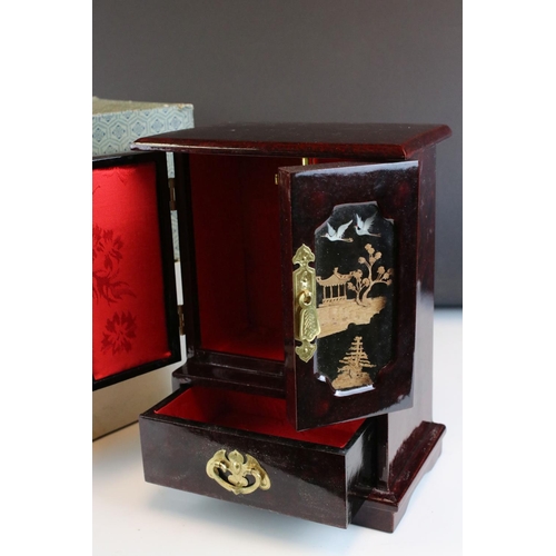 89 - Boxed lacquered Chinese single drawer, double door jewellery box with cork & stork diorama behind gl... 