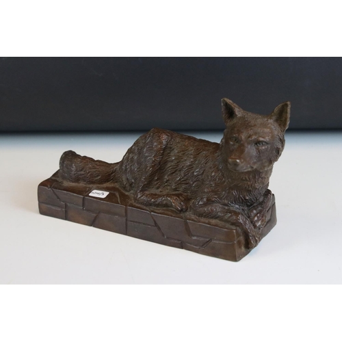 90 - Solid bronze recumbent fox on wall effect plinth