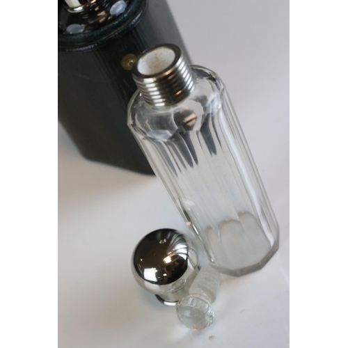 95 - Three glass perfume / cologne bottles with silver plated screw top lids and glass stoppers in a fitt... 