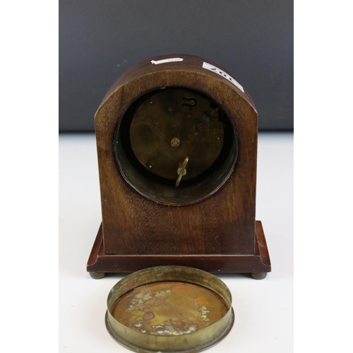 107 - An early 20th century mahogany dome topped mantle clock with string inlay decoration.