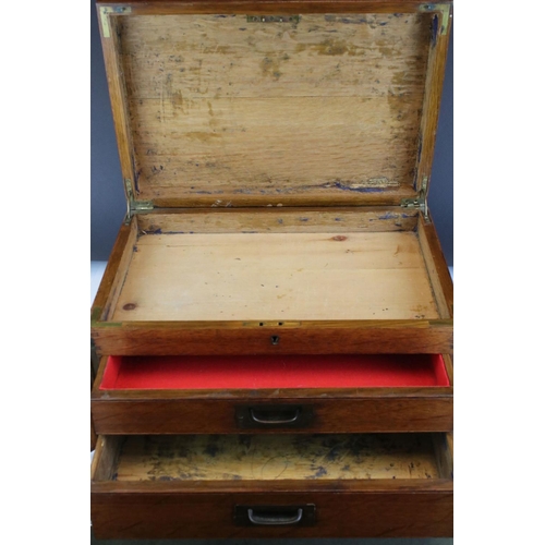 117 - An early 20th century oak two drawer canteen with brass handles.