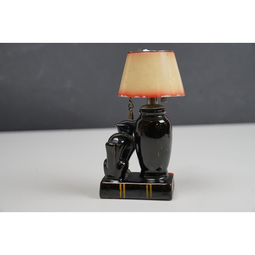 166 - A vintage ceramic table lighter in the form of a lamp with black cat.