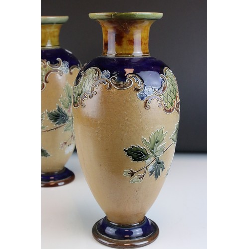 8 - Doulton Lambeth Stoneware Vases with floral spray decoration, each approx 31cms high