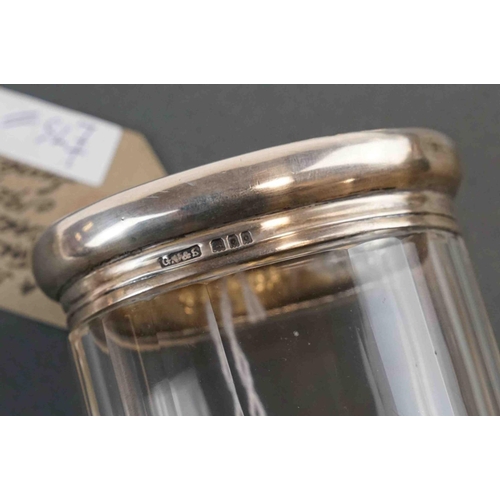 189 - A fully hallmarked sterling silver topped dressing table jar together with a silver plated example, ... 