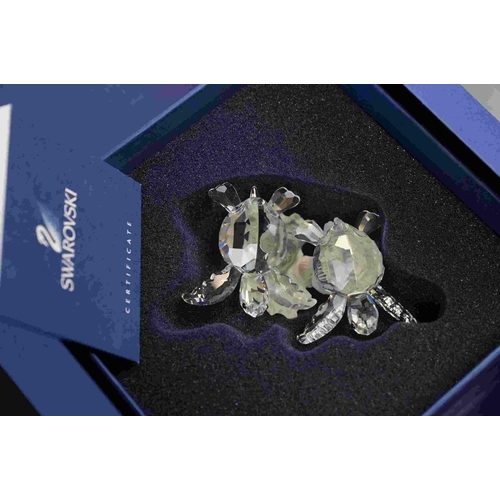 196 - Two boxed Swarovski crystal ornaments to include fish in coral (A 7644) and swimming Turtles (A 9100... 