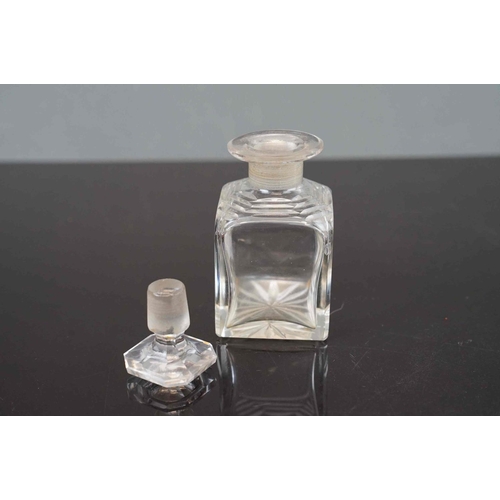 199 - An early 20th century Cased set of three cut glass cologne bottle's contained within a lined dome to... 