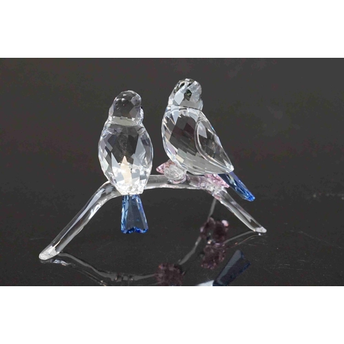 208 - A boxed Swarovski crystal ornament of birds on a branch.