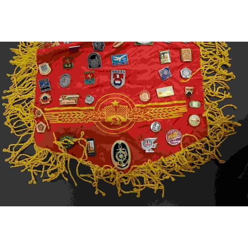 218 - A collection of USSR / CCCP Russian propaganda badges attached to a similar flag.