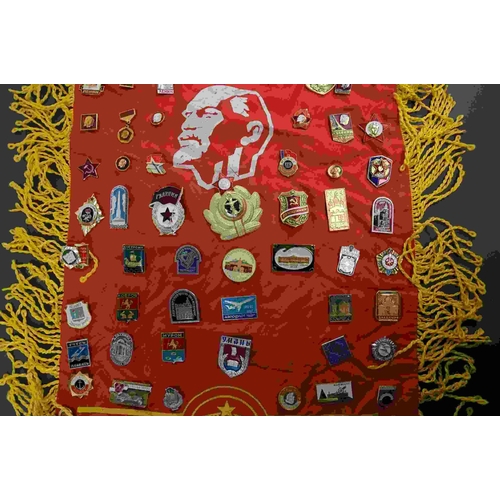 218 - A collection of USSR / CCCP Russian propaganda badges attached to a similar flag.