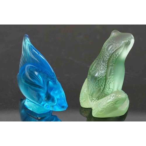 219 - Two boxed Lalique glass ornaments to include a fish and a frog.