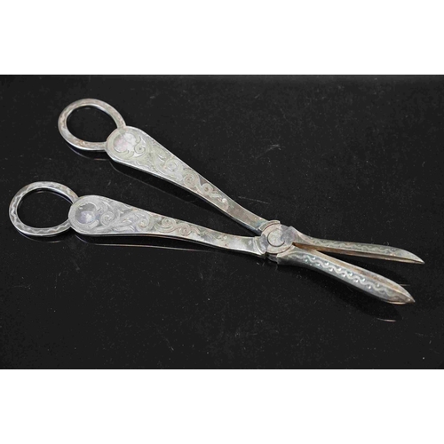 232 - A small collection of silver plate to include water jug and a pair of grape scissors.