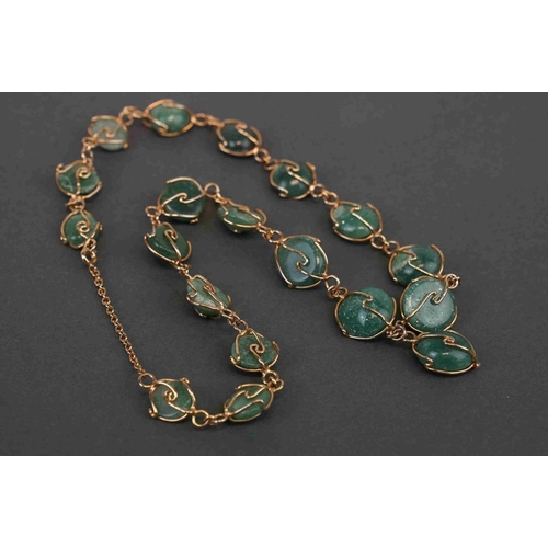 270 - A set of jade and yellow metal jewellery to include necklace, bracelet and earrings.