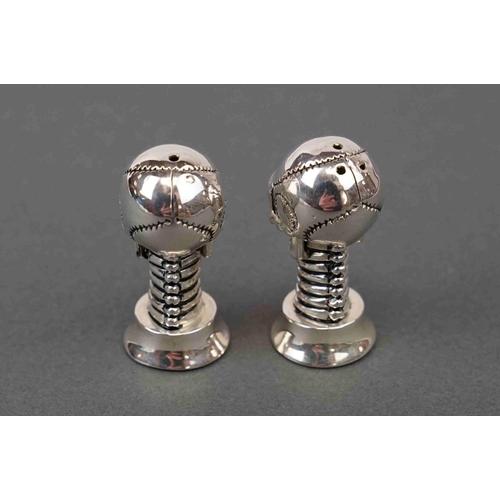 291 - Pair of silver plated condiments in the form of skulls with ruby eyes