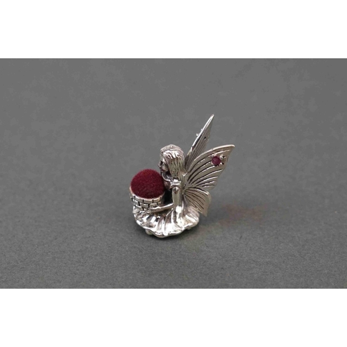 292 - Silver pincushion in the form of a seated fairy, stamped sterling