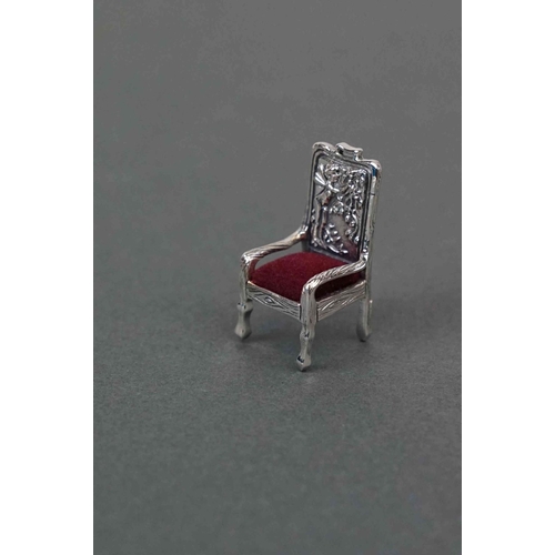 299 - Silver pincushion in the form of a chair, stamped sterling