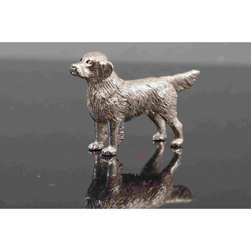 312 - A small group of three cast metal dog figures to include a dachshund.