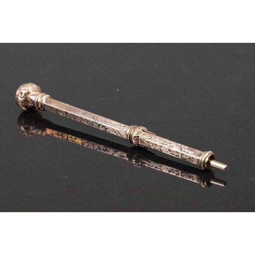 318 - An antique 9ct gold propelling pencil with carnelian finial.