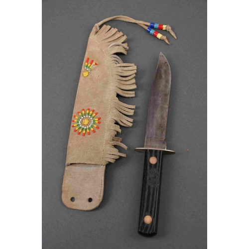 340 - Two American pen knives together with a German sheath knife and another similar example.