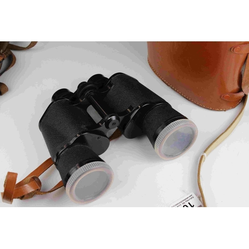 102 - Cased set of Binoculars together with a small vintage leather cased field telescope.