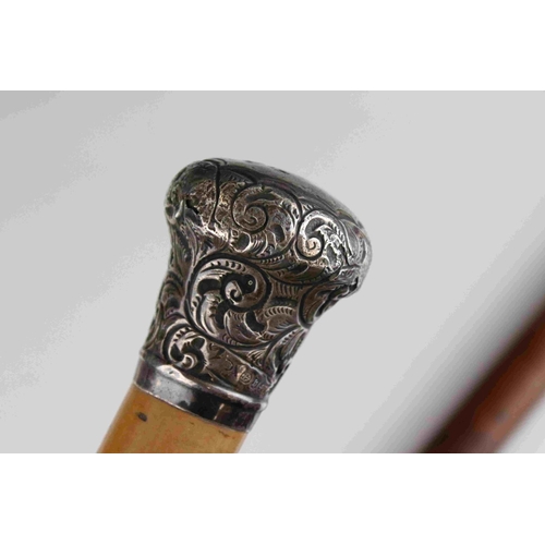 108 - An antique silver topped walking cane and one other similar with white metal handle.