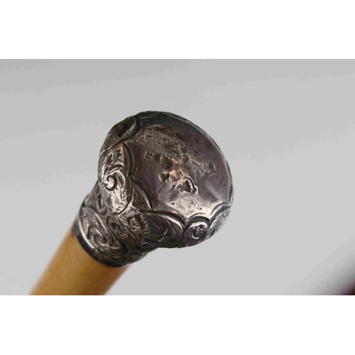 108 - An antique silver topped walking cane and one other similar with white metal handle.