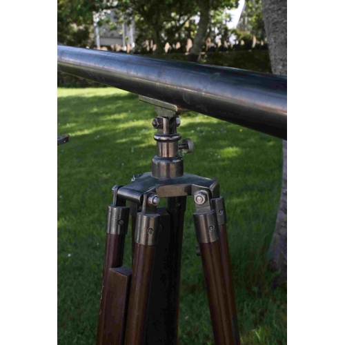 109 - A contemporary telescope with wooden tripod stand.