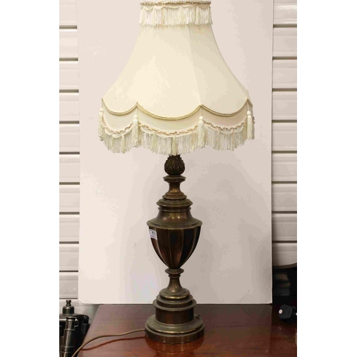 110 - A pair of mid 20th century brass antique style lamps with shades.