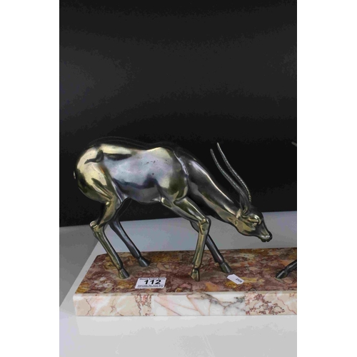 112 - Art Deco pair of spelter Antelope mounted on a marble plinth, 55cms long