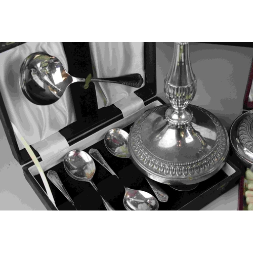 115 - A quantity of silver plate to include candlesticks, cased knife sets, teapot, sugar bowl etc.