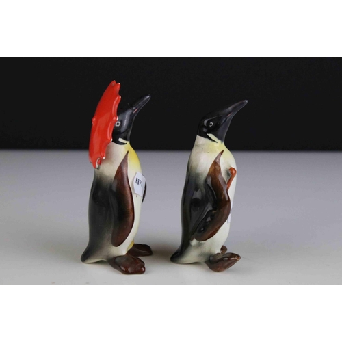 15 - Two Beswick Penguins, including Penguin with Umbrella model 802 and Penguin with Walking Stick model... 