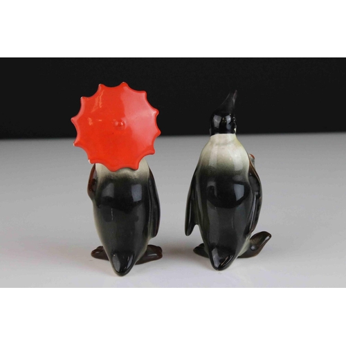 15 - Two Beswick Penguins, including Penguin with Umbrella model 802 and Penguin with Walking Stick model... 