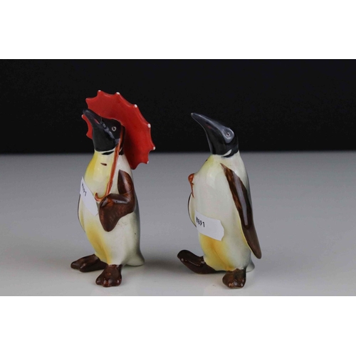 15 - Two Beswick Penguins, including Penguin with Umbrella model 802 and Penguin with Walking Stick model... 