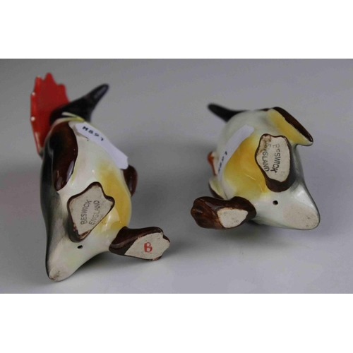 15 - Two Beswick Penguins, including Penguin with Umbrella model 802 and Penguin with Walking Stick model... 