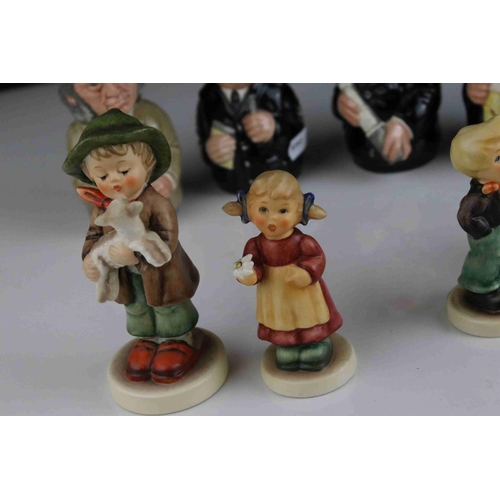 28 - Group of four Goebel Hummel Figures, one with a , lamb, and four small Royal Doulton Doultonville Co... 