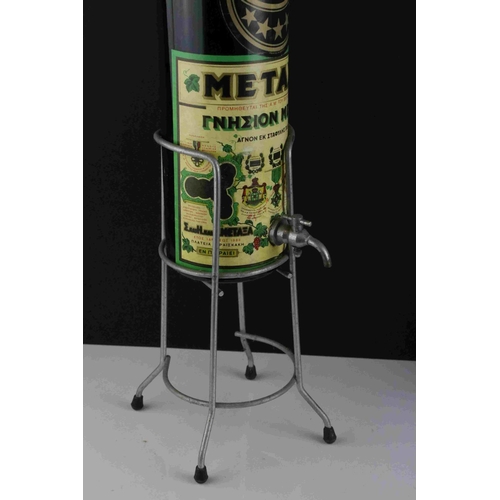 37 - Mid 20th century oversized Metaxa bottle with tap on a Metal stand, 77cms high