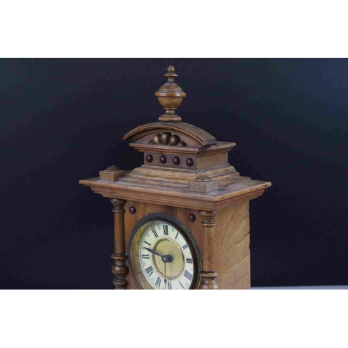 45 - Early 20th century Oak cased mantel clock with column and finial decoration, 29cms high