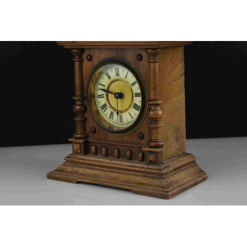 45 - Early 20th century Oak cased mantel clock with column and finial decoration, 29cms high