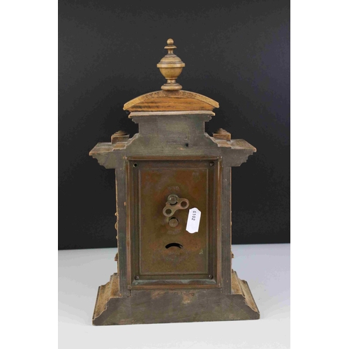 45 - Early 20th century Oak cased mantel clock with column and finial decoration, 29cms high