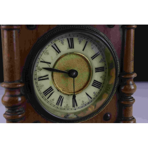 45 - Early 20th century Oak cased mantel clock with column and finial decoration, 29cms high