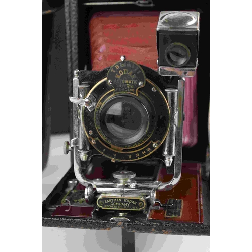 47 - Early 20th century Kodak Automatic red leather bellows camera with leather case