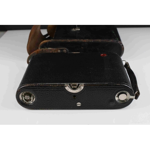 47 - Early 20th century Kodak Automatic red leather bellows camera with leather case