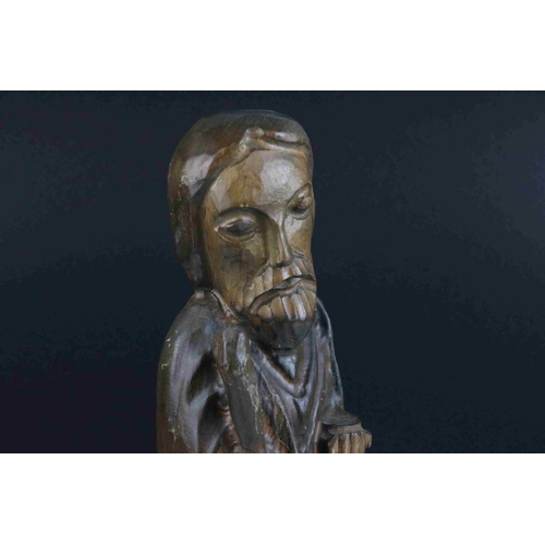 48 - A carved wooden figure of a religious figure.