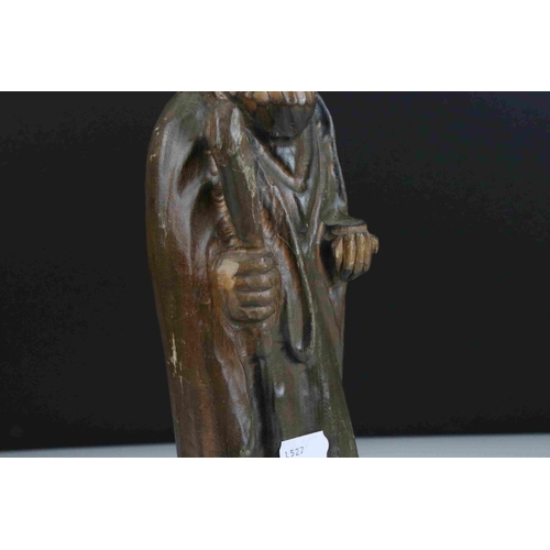 48 - A carved wooden figure of a religious figure.