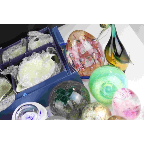 71 - A collection of over thirty glass paperweights to include Caithness examples.