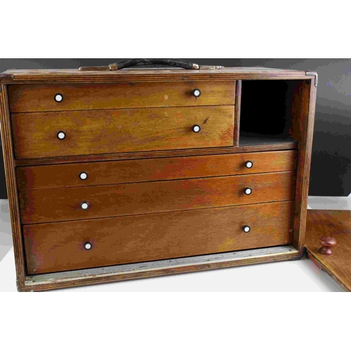 77 - A vintage wooden portable collectors cabinet with 5 internal drawers of various sizes.