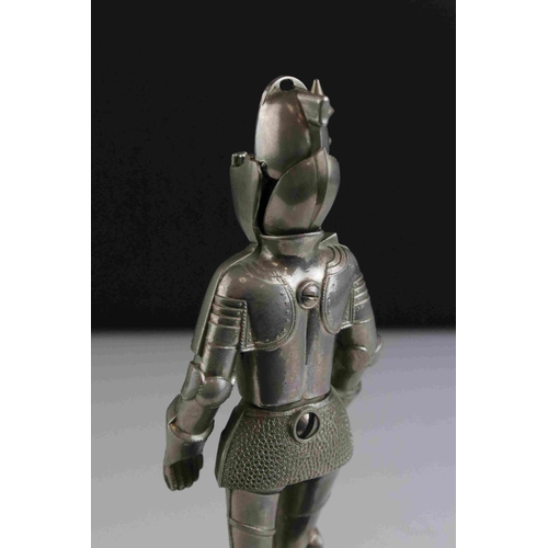 81 - A German musical table cigarette lighter in the form of a knight.