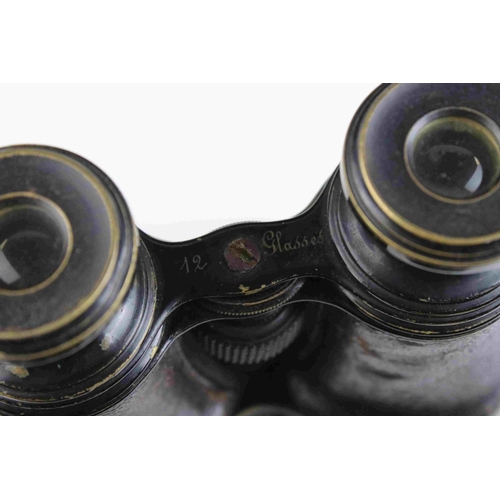 83 - A pair of world war one era British military issued field binoculars, marked with the broad arrow an... 