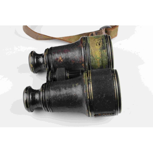 83 - A pair of world war one era British military issued field binoculars, marked with the broad arrow an... 